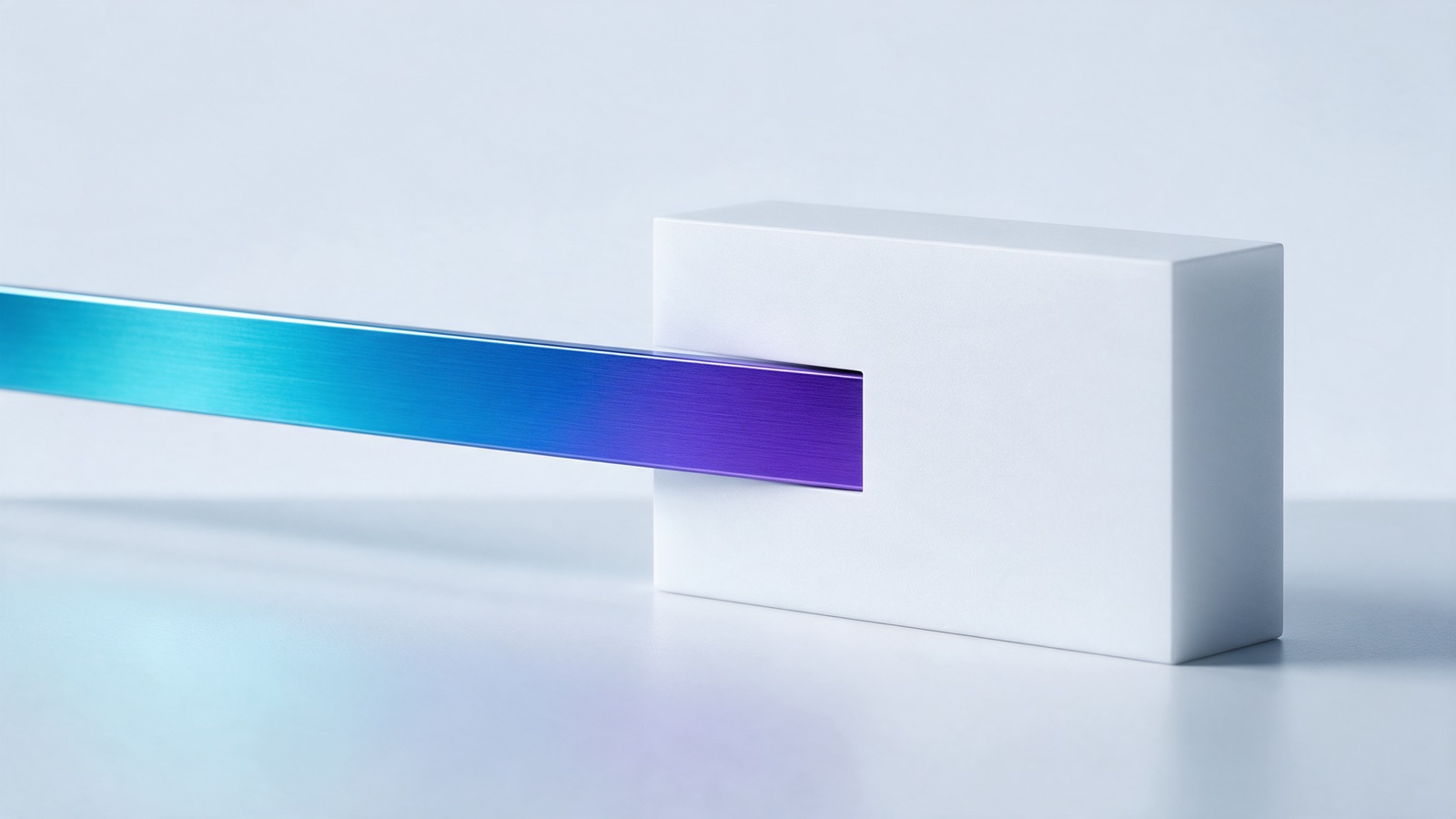 A milled aluminium ribbon threading precisely through a single narrow slot cut in a white block.